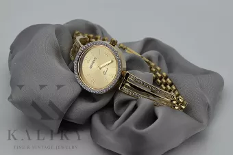 This is a 14K Geneva, Italian, zirconia, 23mm gold watch