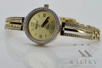 This is a 14K Geneva, Italian, zirconia, 23mm gold watch
