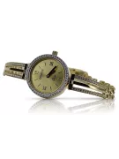 This is a 14K Geneva, Italian, zirconia, 23mm gold watch