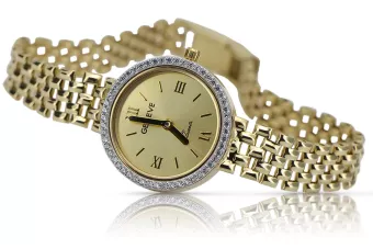This is a 14K Geneva, Italian, zirconia, 23mm gold watch