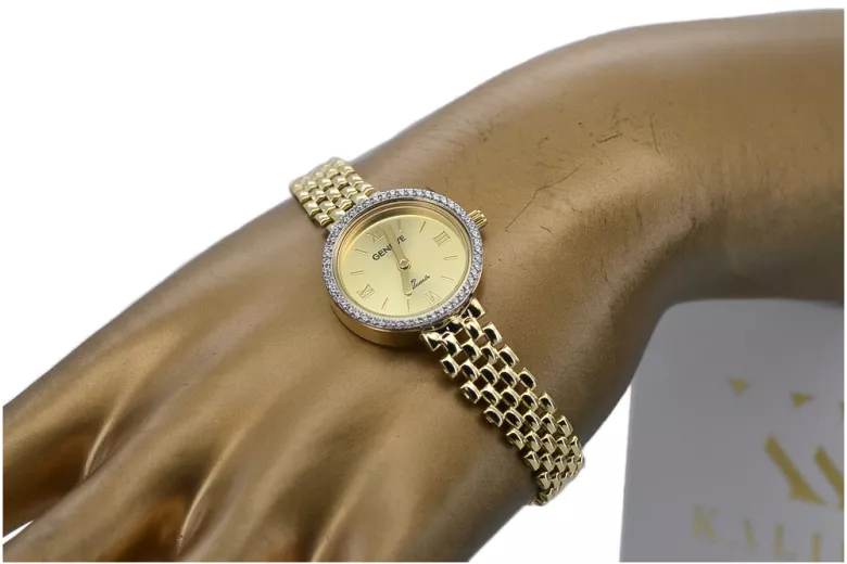 This is a 14K Geneva, Italian, zirconia, 23mm gold watch