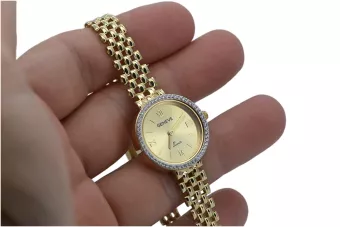 This is a 14K Geneva, Italian, zirconia, 23mm gold watch
